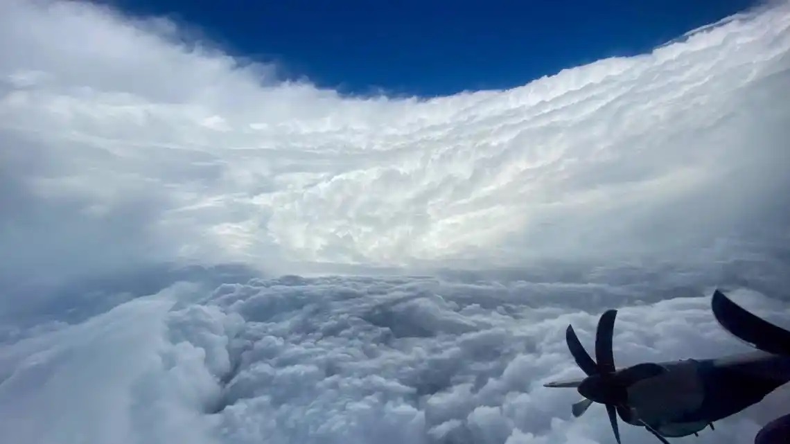 A picture taken from the cockpit of a NOAA “Hurricane Hunter” after breaking out of the eye wall and into the eye of a storm. (NARA) A picture taken from the cockpit of a NOAA “Hurricane Hunter” after breaking out of the eye wall and into the eye of a storm. (NARA)